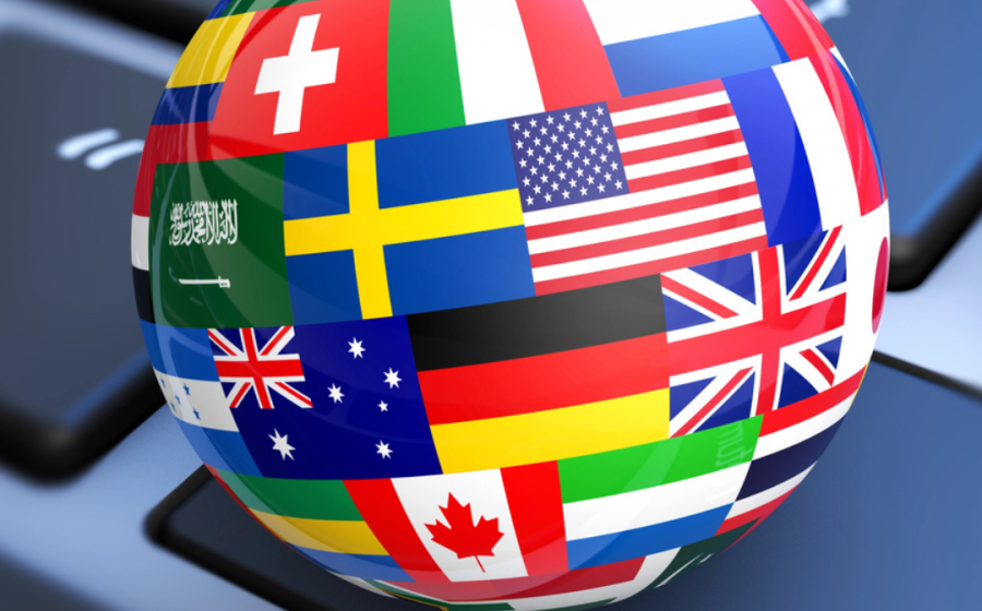 Globe of flags atop a keyboard