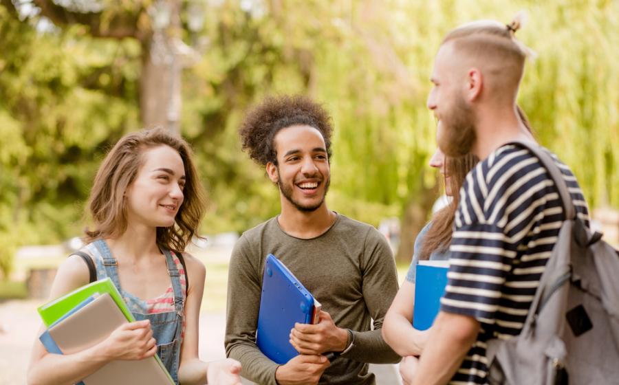 Group of college students outside talking