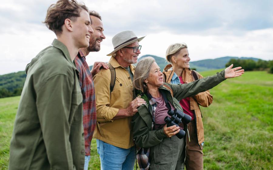 Multigenerational family on hiking trip in autumn nature