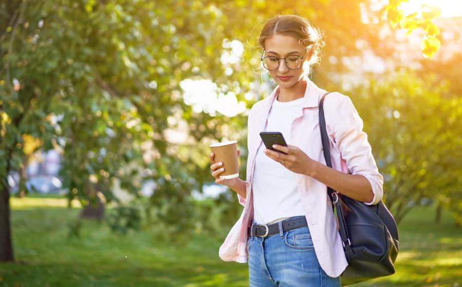 Businesswoman using smartphone Outdoors