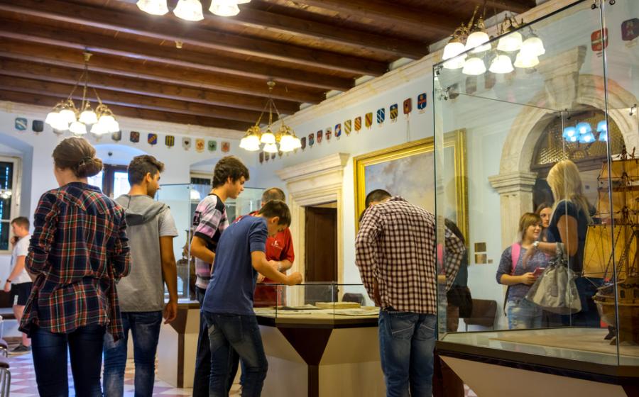 Maritime Museum of Montenegro. Visitors in the museum hall.