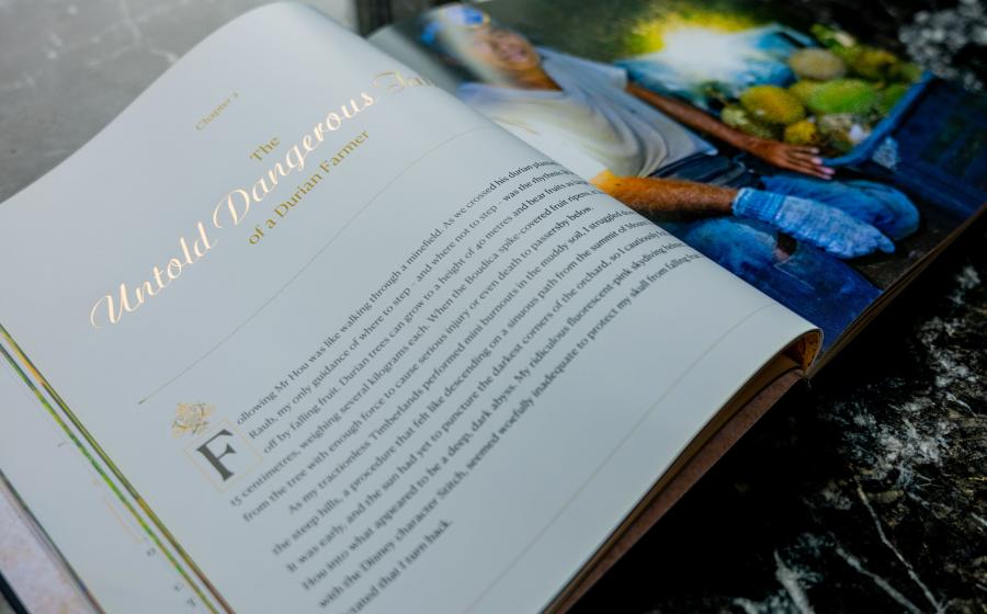 Book page featuring a durian farmer