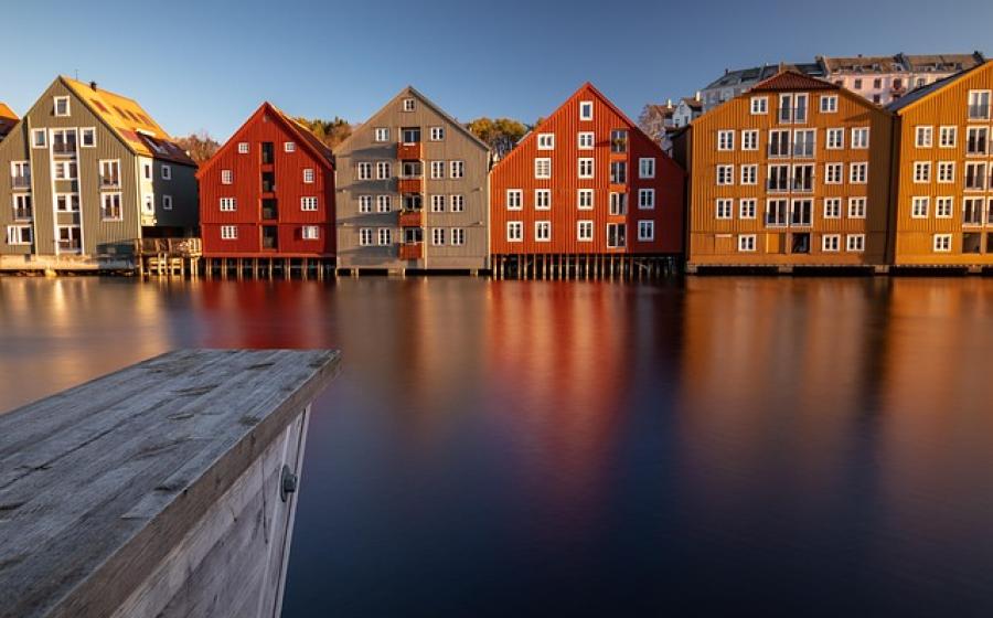 Colorful houses reflected in water in Norway