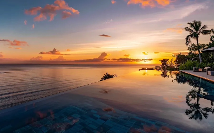 Pool and ocean at sunset at Qunci Villas, Lombok