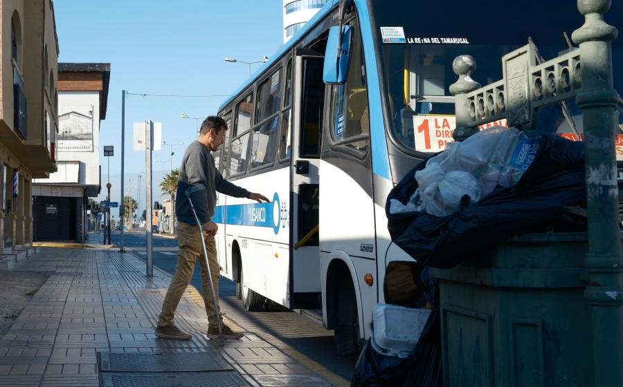 person getting on an accessible bus