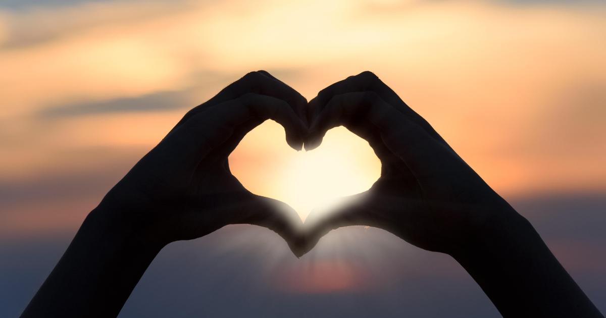 heart and hands at sunset