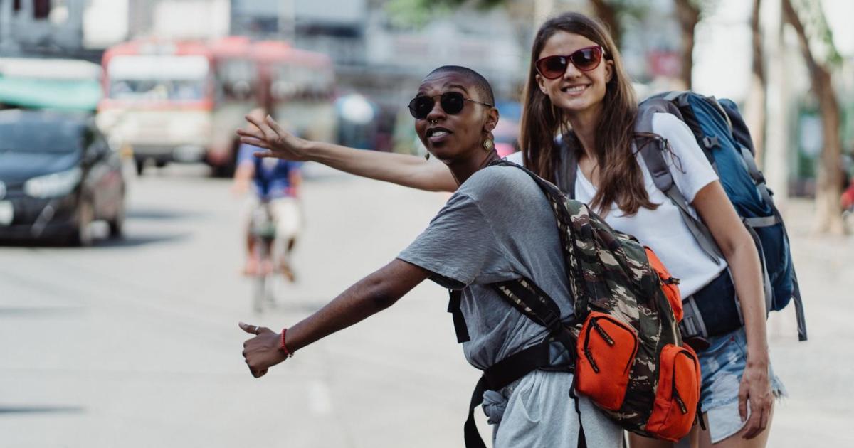 two women hitchhiking